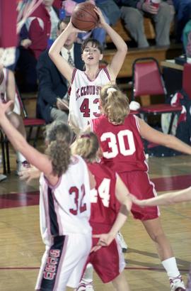 St. Cloud State women's basketball player Tina Schreiner looks to pass the ball against the University of South Dakota