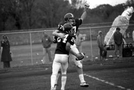 Mike Mullen and Dan Johnson celebrate a touchdown during a football game against the University of Minnesota-Morris, St. Cloud State University