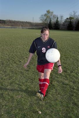 Chris Fleischer dribbles a soccer ball, St. Cloud State University