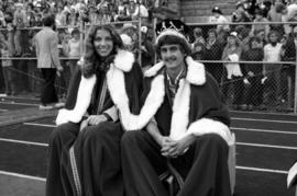 Homecoming queen Linda Marson and king Fred Estrom at the football game, St. Cloud State University