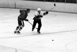 St. Cloud State University hockey player Mike Vannelli chases the hockey puck during a game against St. John's University