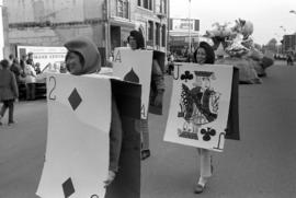 People dressed as playing cards march in the homecoming parade, St. Cloud State University