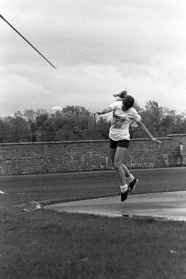 Woman throws a javelin in a track and field meet, St. Cloud State University