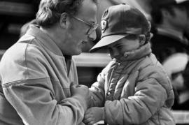 A man and boy at the St. Cloud State University baseball game against Southwest State University