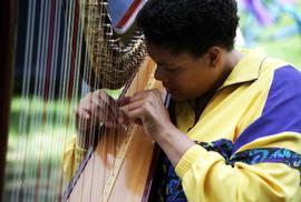 Woman plays a harp, Lemonade Concert and Art Fair, St. Cloud State University