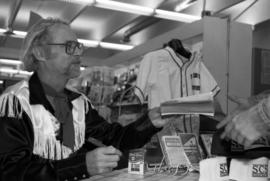 Author W.P. Kinsella signs autographs, St. Cloud State University