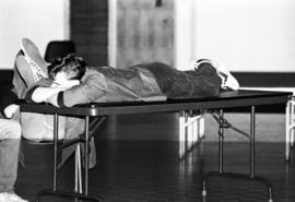 A man relaxes during the KVSC trivia weekend closing ceremonies, St. Cloud State University