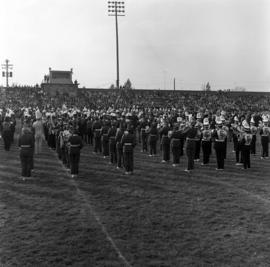 Marching band performing at halftime at the homecoming football game, St. Cloud State University