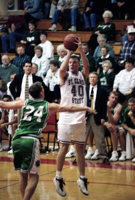 Jason Kron shoots a basketball during a basketball game against the University of North Dakota, St. Cloud State University