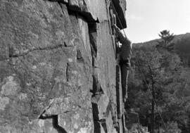 Man climbs up a cliff at the Taylors Falls State Park, St. Cloud State University