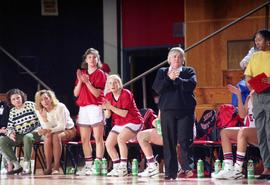 Basketball coach Gladys Ziemer watches play during a game, St. Cloud State University