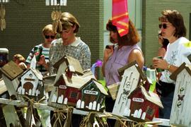 Women look at bird houses, Lemonade Concert and Art Fair, St. Cloud State University