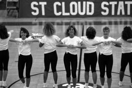 The danceline performs at halftime of a men's basketball game at Halenbeck Hall (1965), St. Cloud State University