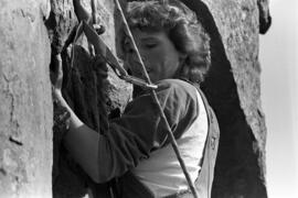 Woman climbs up a cliff at the Taylors Falls State Park, St. Cloud State University