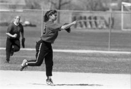 Softball player Mary Libbesmeier throws a ball during a softball game, St. Cloud State University