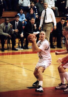 Zach Goring gets ready to pass a basketball during a game, St. Cloud State University