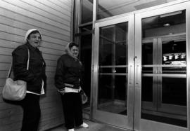 Loretta Warzecha and Dorothy Schleicher wait to enter Garvey Commons (1963), St. Cloud State University