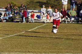 Kim Corbin kicks a soccer ball during a soccer game against Winona State University, St. Cloud State University