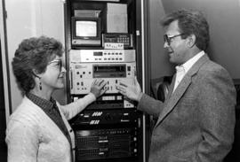 Marilyn Moser and Harlan Jensen with photo technology equipment, St. Cloud State University