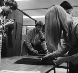 Students make armbands to protest the death of Kent State students, St. Cloud State University