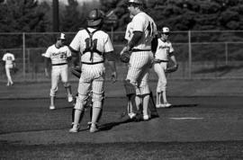 Coach Denny Lorsung visits the pitching mound during a St. Cloud State University baseball game against Northern State University