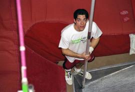 Pole vaulter Dustin DesRosier stands with his pole, St. Cloud State University