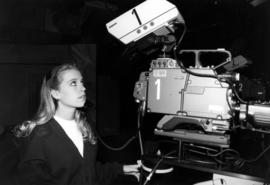 Woman runs a television camera, St. Cloud State University