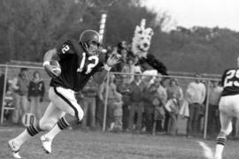 St. Cloud State football player Keith Nord runs with the football in a game against the University of Minnesota-Morris