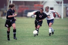 Kim Corbin kicks a soccer ball during a soccer game, St. Cloud State University