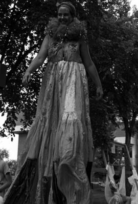 A woman walks on stilts, Lemonade Concert and Art Fair, St. Cloud State University