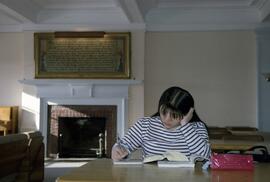 A student studies inside the Shoemaker Hall lounge, St. Cloud State University