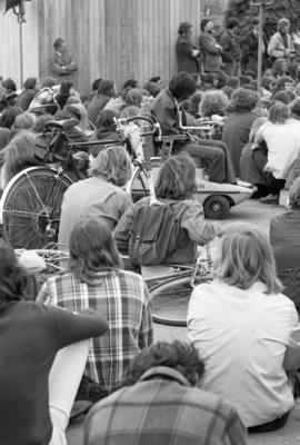 Protestors sit and listen to a speech, Day of Peace protest, St. Cloud State University