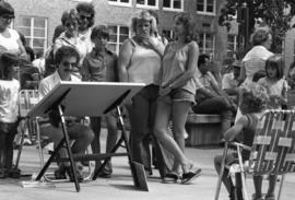 An artist draws a caricature, Lemonade Fair, St. Cloud State University