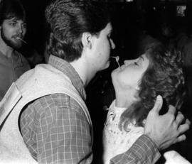 Gary Grover and Gwen Bachmann playﾠ games during Winter Week coronation, St. Cloud State University