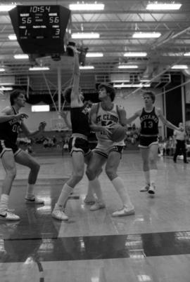 St. Cloud State University basketball player Dan Hagen drives towards the basket during a game against Southwest State University