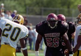 St. Cloud State University football player Corey Miller stands on the field during a game against North Dakota State University