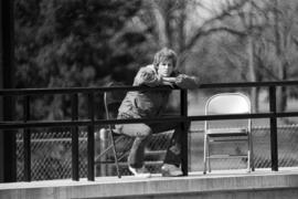 A man watches the St. Cloud State University baseball game against Southwest State University