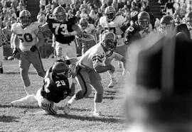 A St. Cloud State football player tackles North Dakota State University player, St. Cloud State University