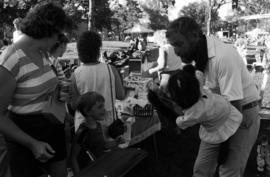 A child watches a man and his puppet, Lemonade Concert and Art Fair, St. Cloud State University