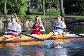 Rowing Club members row in a boat, St. Cloud State University