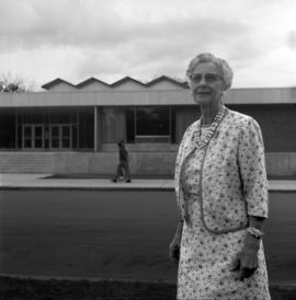 Beth Garvey, standing in front of Garvey Commons (1963), St. Cloud State University