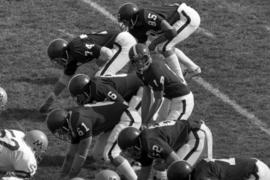 St. Cloud State University football team offensive line lines up for a play in a homecoming game against the University of Minnesota-Duluth