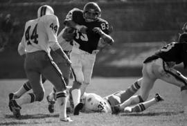 St. Cloud State University football player Mike Mullen runs the ball during a football against the University of Minnesota-Duluth