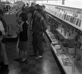 Student wait to buy books at the Stewart Hall (1948) bookstore, St. Cloud State University