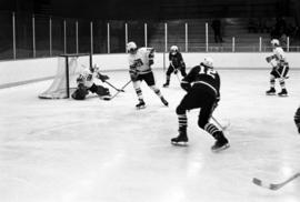 St. Cloud State player Tom Splinter takes a shot during hockey game with St. John's University