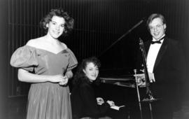 Performing at Apollo High School are Peggy Kriha, Lisa Caron, and Billy Soden, St. Cloud State University