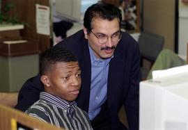 Shahzad Ahmad helps an Advanced Preparation Program student, St. Cloud State University