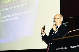 Joseph Newhouse speaks at the Winter Institute, St. Cloud State University