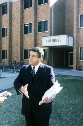 St. Cloud State alum J.P. Bolduc stands in front of the Business Building (1968)