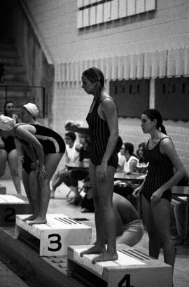 Swimmers prepare for a race in a meet with Gustavus Adolphus, St. Cloud State University